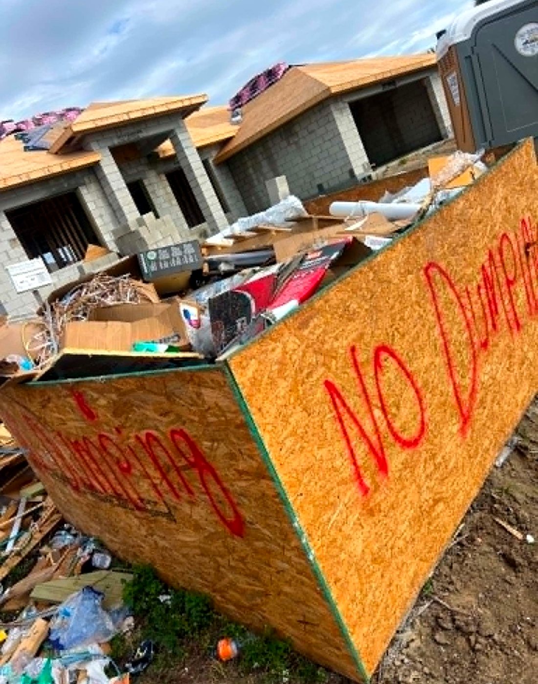 Construction debris box full at a Brevard job site