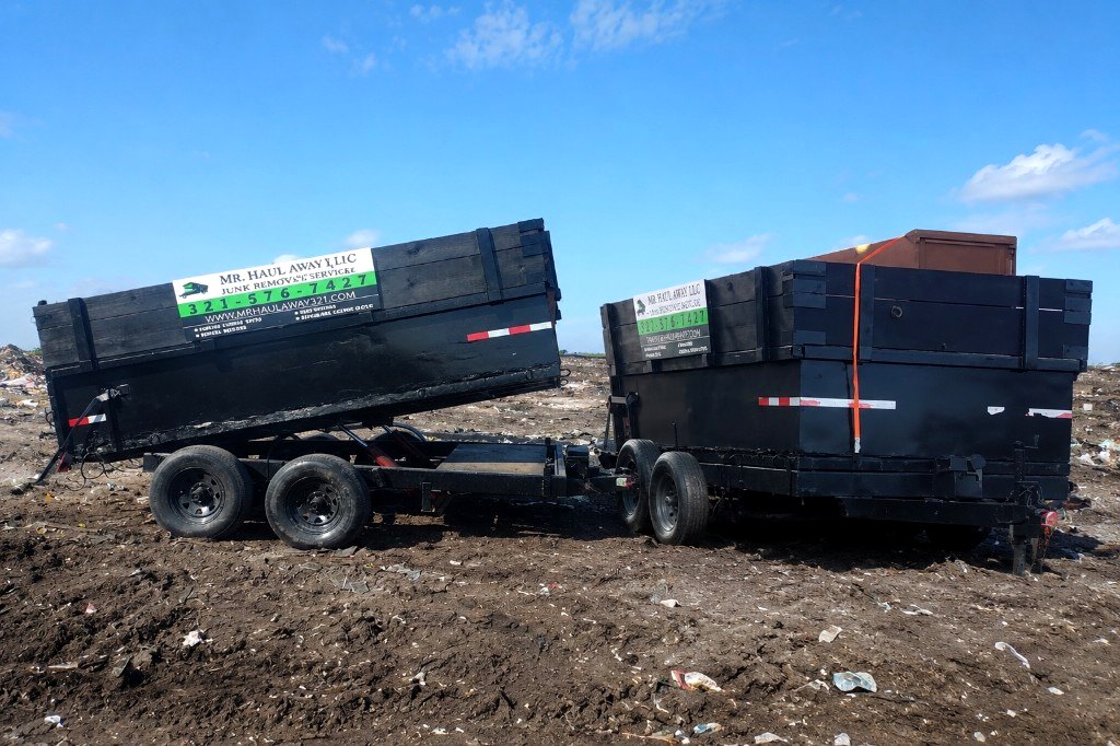 Both Mr. Haul Away dump trailers at the disposal site